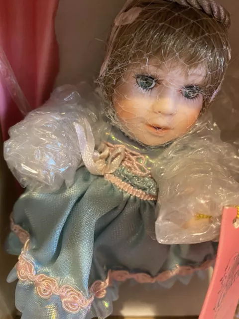 "Paradise Galleries-Treasury Collection" Birthstone Angel Porcelain Doll 'JUNE'