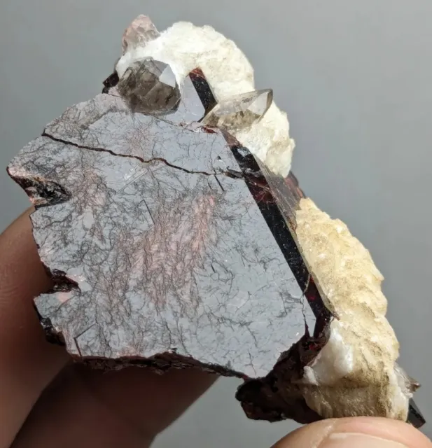 Natural unusual large and etched spessartite garnet with Albite and Quartz