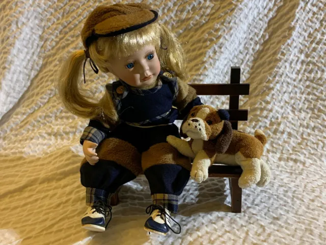 Jaime The Tomboy Porcelain Doll With Dog sitting on Bench