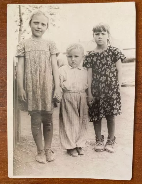 Beautiful little girls holding hands with brother, cute children Vintage photo