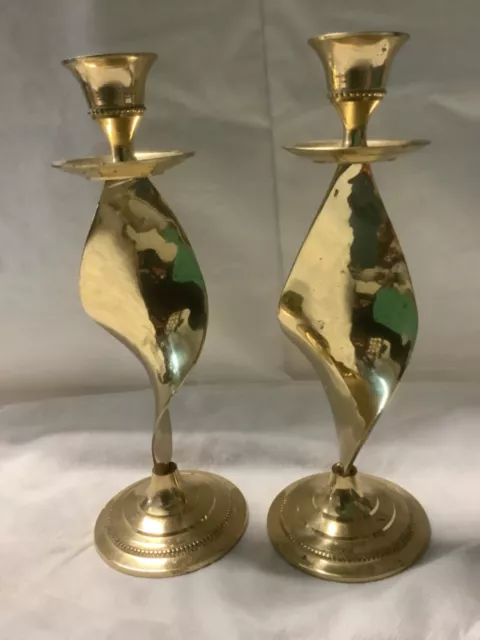 Pair of brass metal candlesticks. 21cm  high       (RW)