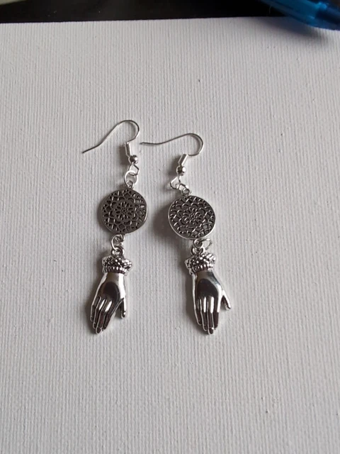 Antique hand earrings with decorative mandala