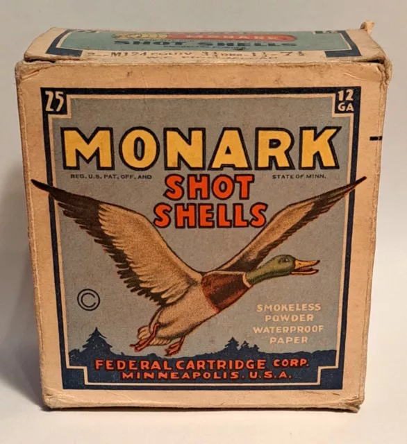 A vintage Federal Cartridge Monark 12 gauge shotgun shell wooden