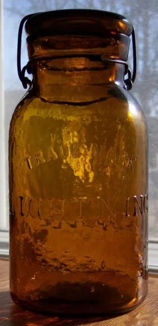 Sparkling Whittled Orange Amber Antique Glass TRADE MARK LIGHTNING Fruit Jar