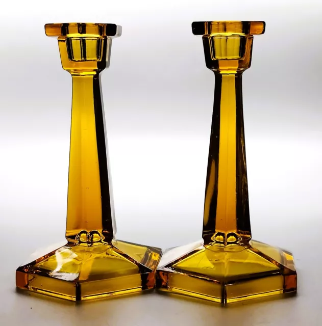 A Pair of Art Deco Davidson Glass 283/4 Amber Candlesticks 1912 to 1936