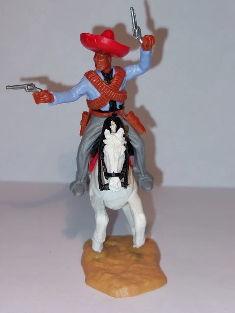 TIMPO Cavalier mexicain tirant avec 2 pistolets sur cheval blanc au galop