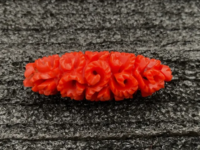 Vintage deeply carved celluloid or bakelite flowers solid red pin brooch