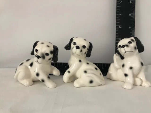 Three (3) Dalmatian puppies ceramic figurines, brothers and sisters
