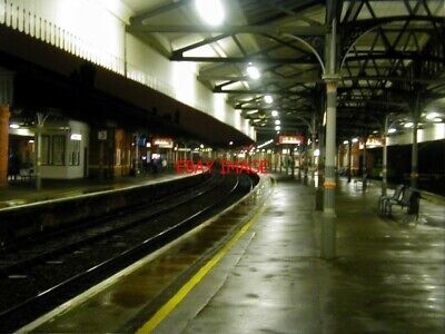Photo  2001 Salisbury Railway Station On A Wet February Evening.