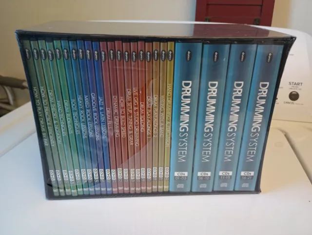 Drumming System by Mike Michalkow 21 CD's and 20 DVD's in the original box.