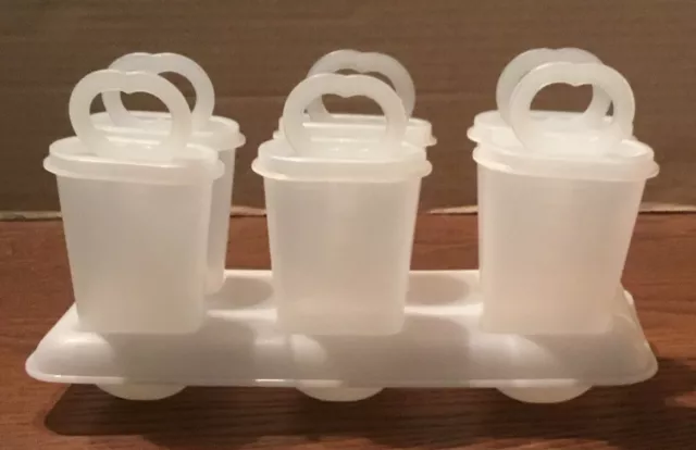https://www.picclickimg.com/fyoAAOSwV9plP~~Y/Vintage-Complete-Set-Tupperware-Ice-Tups-6-Popsicle.webp
