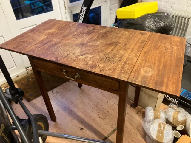 antique drop leave table with castor wheels