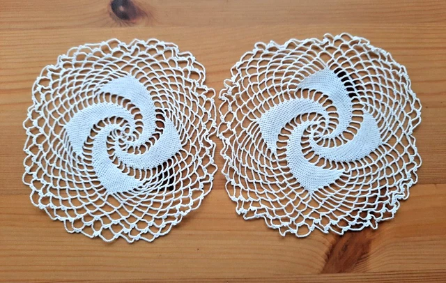 Two white thread crocheted doilies