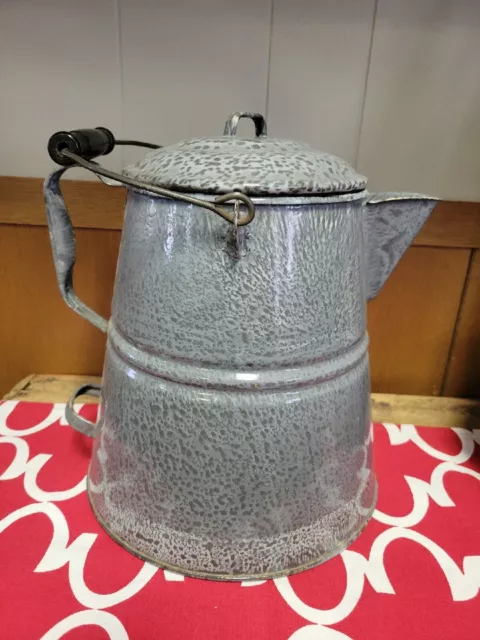 Sold at Auction: 12 GRANITEWARE COWBOY COFFEE POT