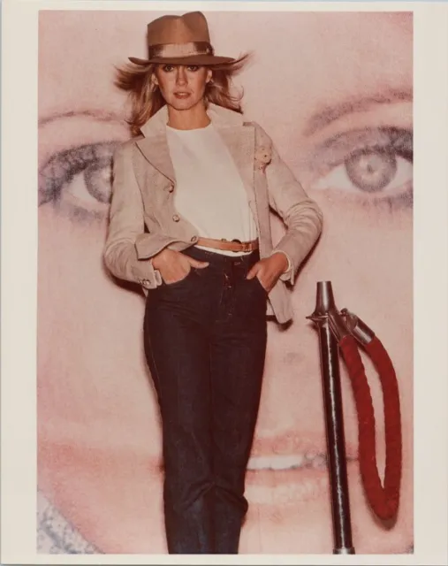 Olivia Newton-John poses in blue jeans and hat from 1970's 8x10 photo