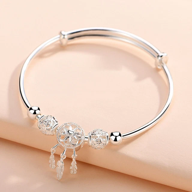 Bracciale donna, forma circolare, color argento, circostanze regolabili, nappa a molla,