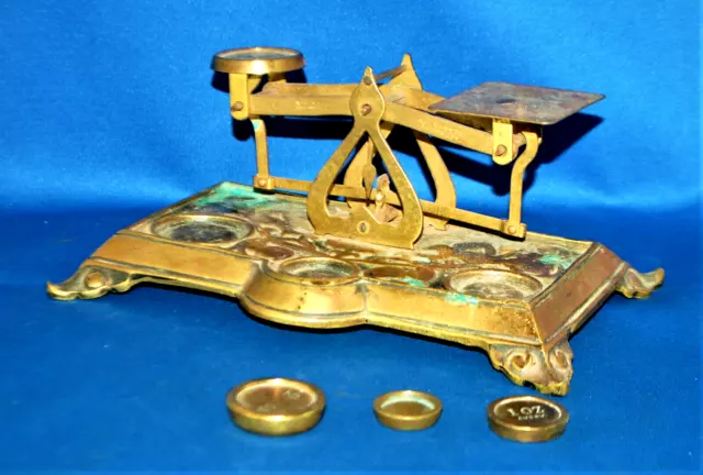 A set of antique 19th century postal scales, brass scroll design, English made
