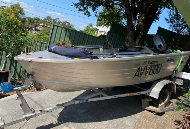 Tinny ready to go  Sea Sprite aluminium boat with 9.9 HP Mariner and trailer
