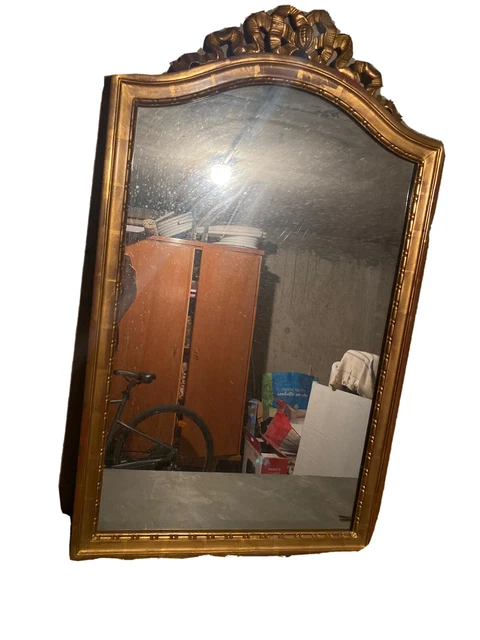 Grand miroir à poser biseauté en bois sculpté doré