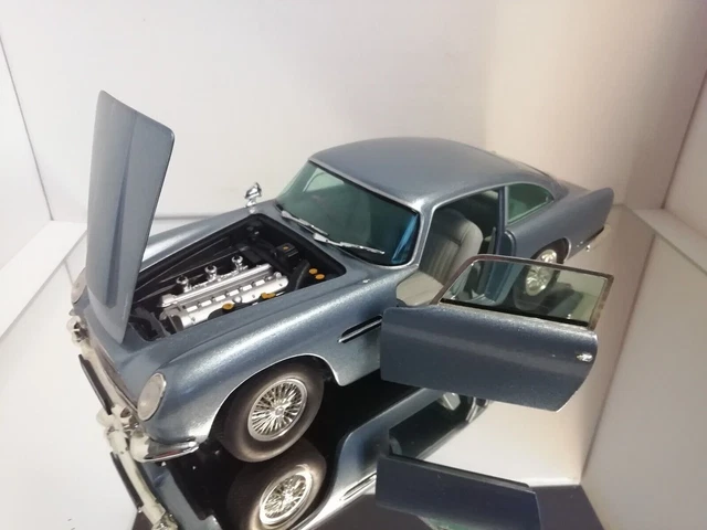 Aston Martin DB5 1963 Rouge Pivoine – Chrono H1002 – Échelle 1:18 – Occasion
