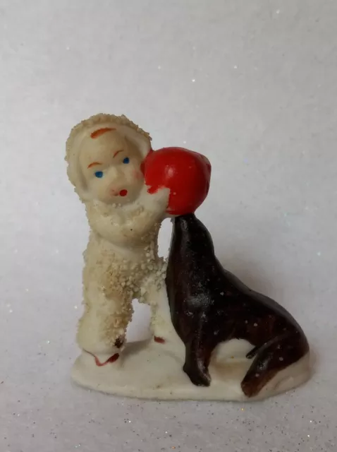 Vintage Bisque Porcelain Snow Baby With Seal And Red Ball, Unmarked 2" Tall