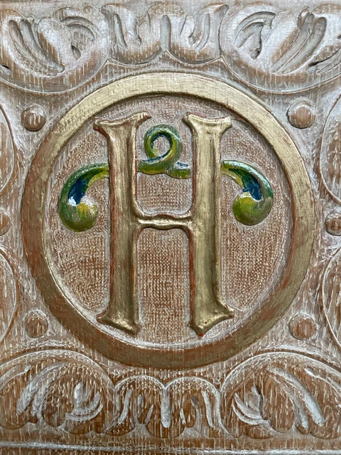 A Stunning Carved Panel in oak with the letter H