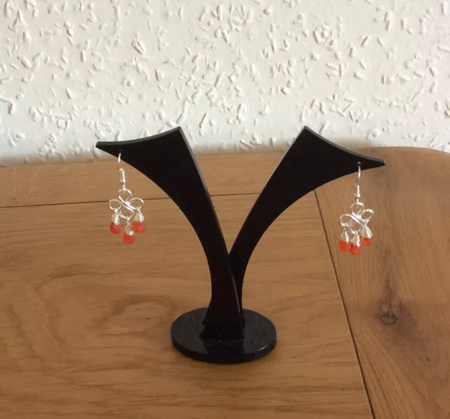 Carnelian Chandelier Earrings. Silver coloured earrings. Lotus themed