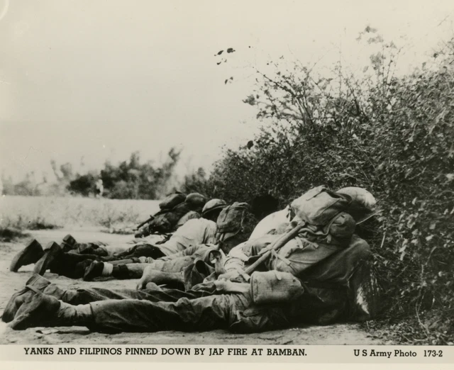 US SOLDIER AND Filipino civilian hiding from Japanese fire Bamban 1945 ...