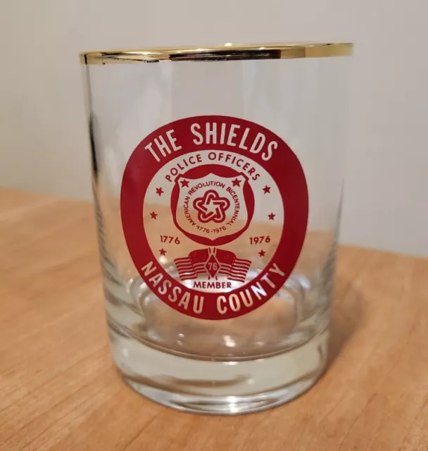 THE SHIELDS  Gold Trim Glass  1976  NASSAU COUNTY POLICE OFFICERS MEMBER