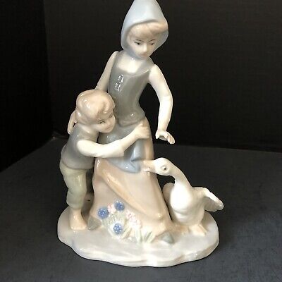 Duncan Royale vintage porcelain Figurine Girl with Child Avoiding the goose.