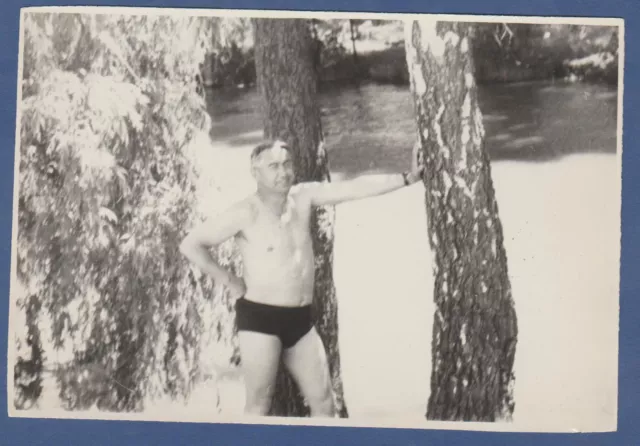 Shirtless guy in swim trunks, bare torso bulges muscles, bare feet Vintage Photo