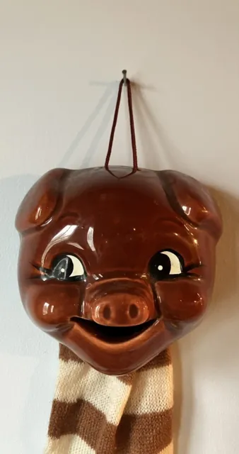 Vintage Wall Hook Cutie Pig Ceramic Mask with sock attached.