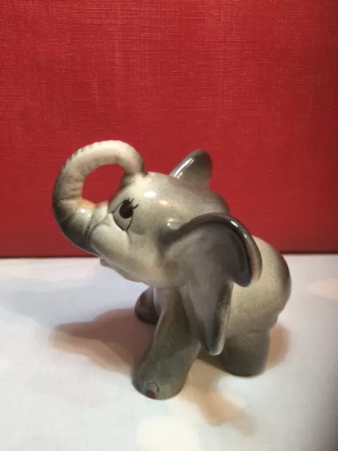 Weatherby pottery.Elephant (comical).110x115mm approx.1950s marked weatherby.Eng