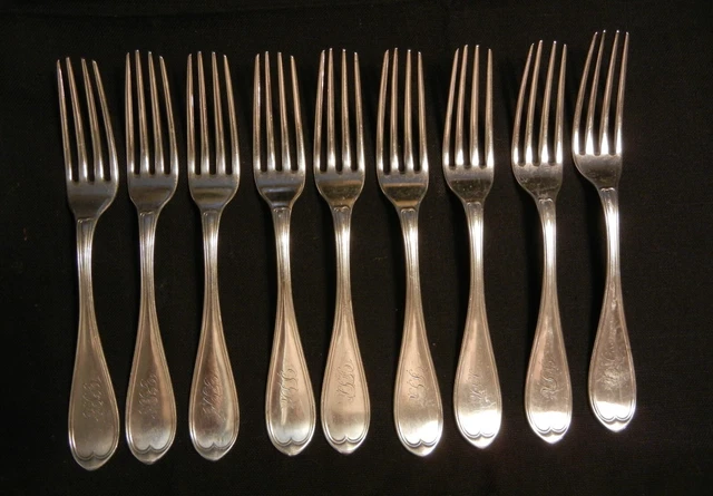 Nine coin silver forks by  Conning of Mobile, Alabama in the oval thread pattern
