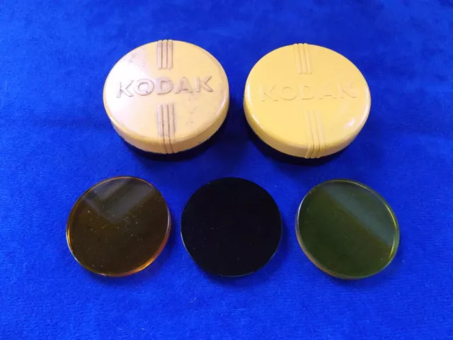 Vintage Kodak Series VI lens filters, amber, green, and yellow, + three cases