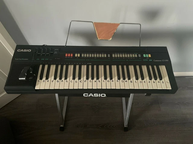 Casio piano keyboard (WITH STAND AND PLUG