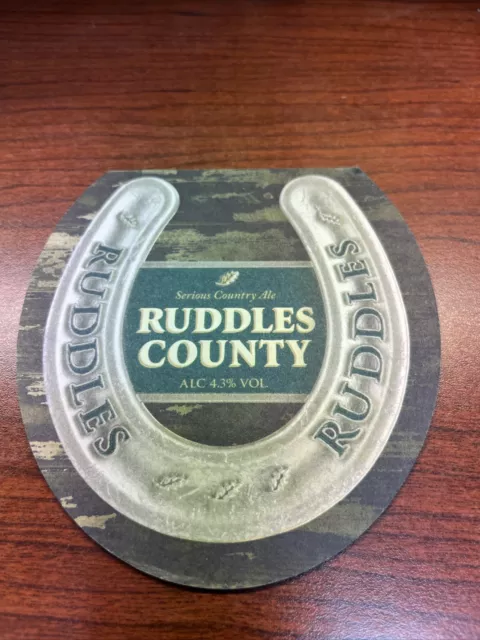 Beer COASTER ~*~ GREENE KING Brewery Ruddles County Ale ~*~ St Edmunds, ENGLAND