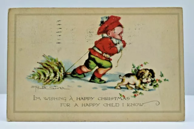 Postcard~Ruth Siver~Boy Dragging Small Christmas Tree Through Snow~Puppy~1924