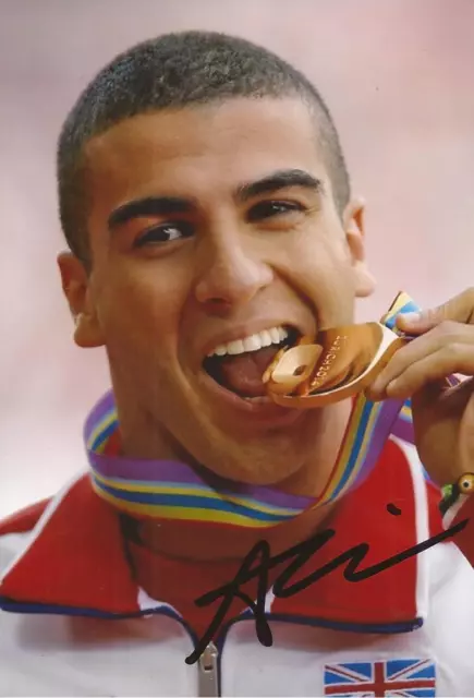 ATHLETICS: ADAM GEMILI SIGNED 6x4 MEDAL ACTION PHOTO+COA *TEAM GB*