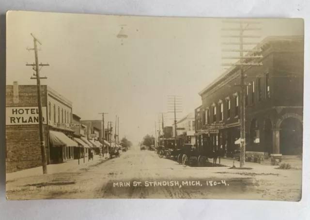 Early 1900s RPPC Main St. Standish Mich Signs Hotels Old Cars Great Image