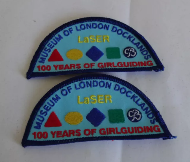 2010 GIRLGUIDING CENTENARY MINT LASER MUSEUM OF LONDON DOCKLANDS BADGE/PATCH x 2