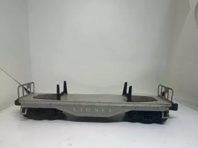 Lionel O Gauge 6121 Flat Car with Pipes (no pipes included) Circa 1956-57 Grey