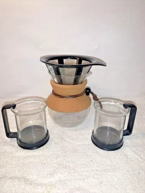A small Bodum 17 oz pour over coffee maker carafe & 2 vintage black handle mugs