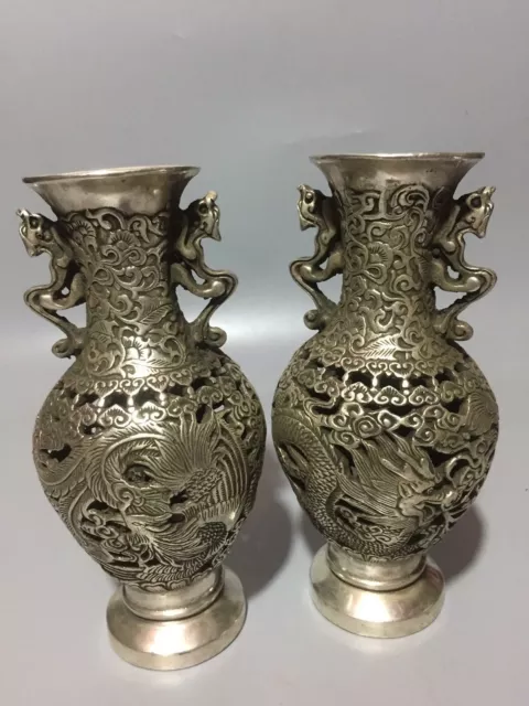 A Pair Old Tibet Silver Handwork Carved Dragon and Phoenix Hollow Vases