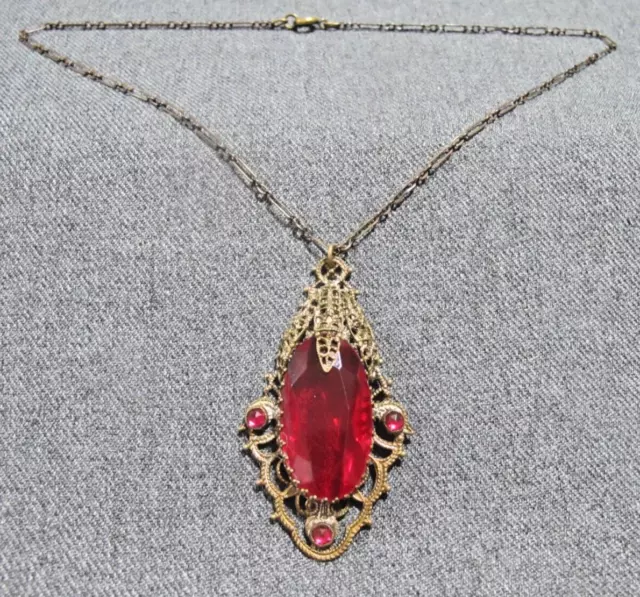 Antique art deco open back red crystal filigree goldotne metal lavalier necklace