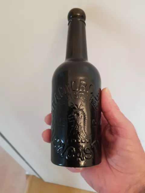 Pictorial Black Glass Half Pint Stout Bottle From Newcastle Very Good Condition.