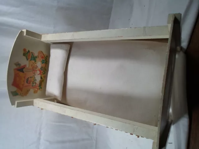 antique toy doll bed with mattress and pillow