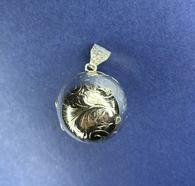 Hallmarked Silver Ball Shaped ￼ Locket, ￼Hand Engraved floral design, no chain.