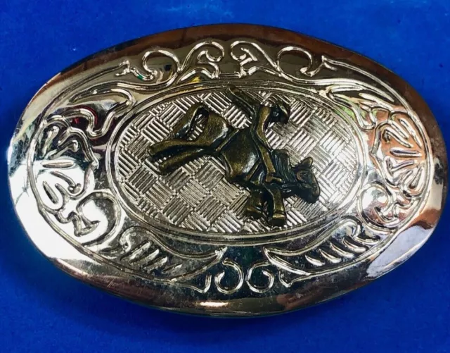 Vintage western silver tone cowboy riding in rodeo saddle bronc belt buckle