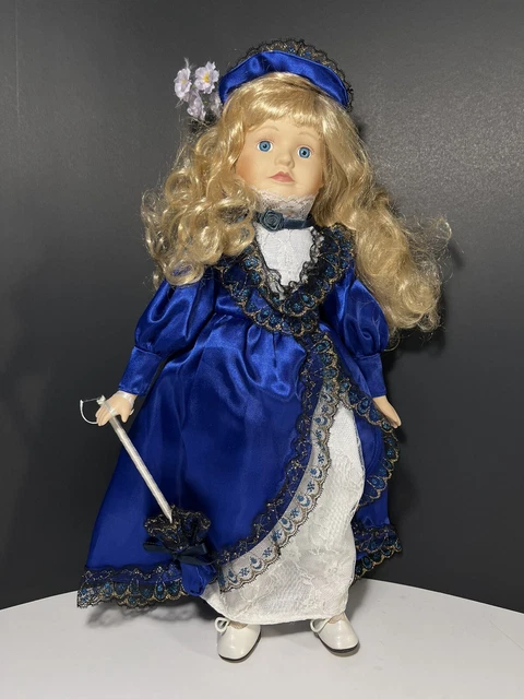 Porcelain doll 16” blue velvet dress long blond curly hair no tags no stand